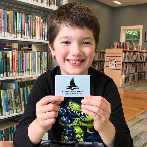 angus child holiding library card small